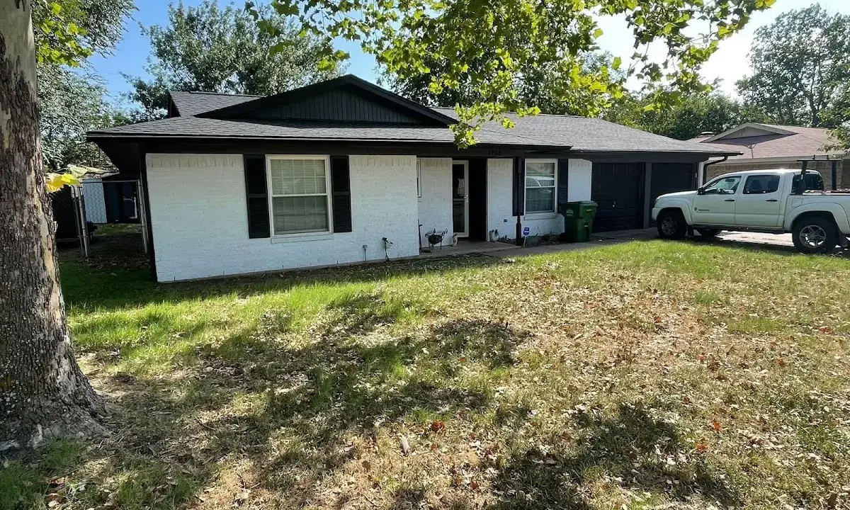 Professional roofing crew working on a residential roof in Mount Carmel